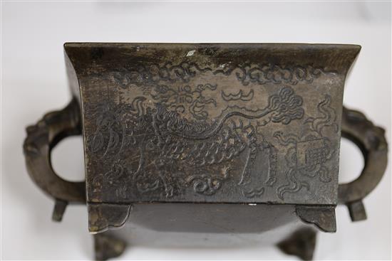 A Chinese bronze two handled censer, W.16cm including handles